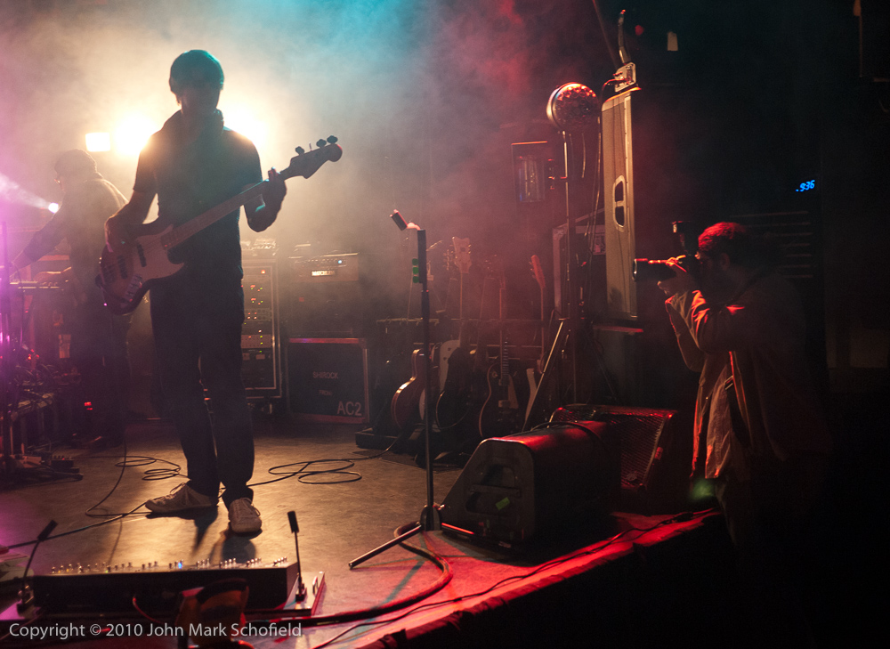 Photographer shooting the band on stage